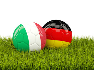 Italy and Germany soccer  balls on grass