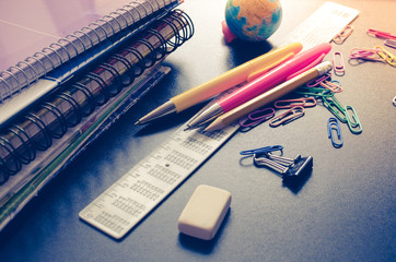 School supplies on blackboard background