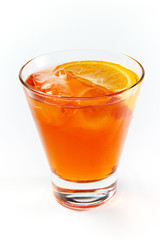 Orange cocktail with ice in a glass isolated on white background