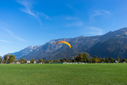 beautiful paragliding field near alpes mountain in switzerland