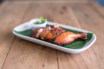 tasty grilled chicken wings on a white dish
