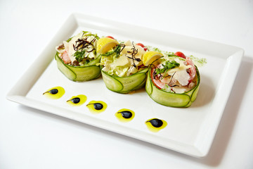 Three vegetable salads on one dish close up isolated on white