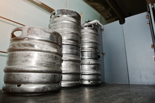 Three metal beer keg barrel
