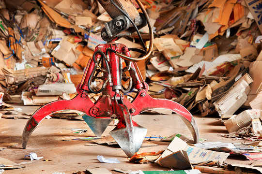 Old Industrial Claw In Recycle Paper Junkyard