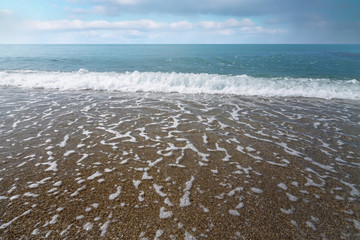 calm waves at the beach / hot summer day photo Crimea