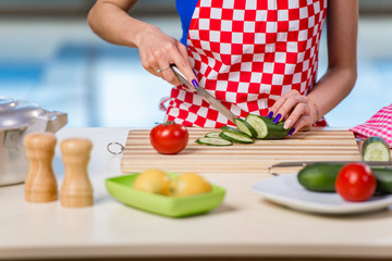 Young woman working in the kitchen