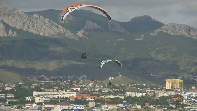Paragliders over the city