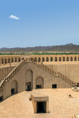 Aerlial view of Nizwa oasis and surrounding mountains