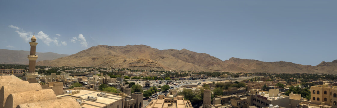 Aerlial view of Nizwa oasis and surrounding mountains
