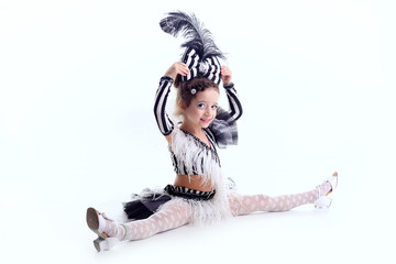 little girl dancing in the dress in the studio