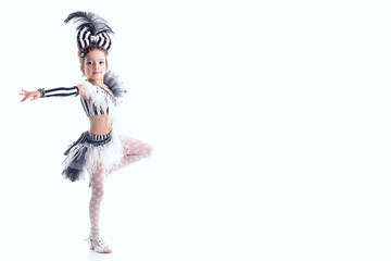 little girl dancing in the dress in the studio