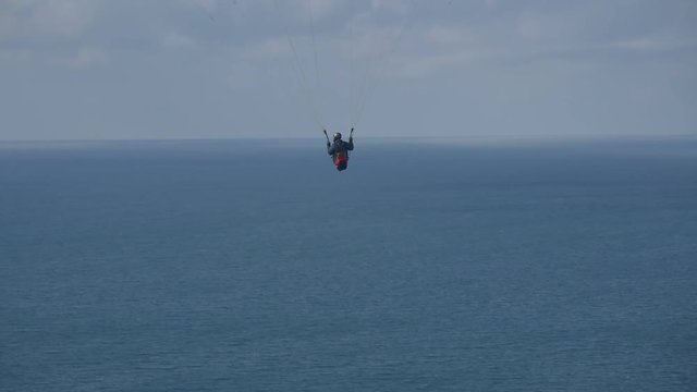 Paraglider pilot over see
