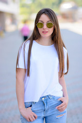 Stylish woman portrait in round glasses , outdoors