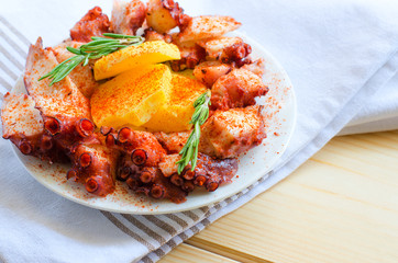 Galician style octopus, pulpo a la gallega or pulpo a Feira. Typical spanish tapas.