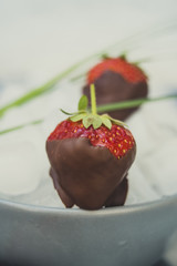Strawberries with chocolate on ice
