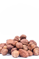 Bunch of hazelnuts over white background with copy space