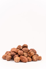 Bunch of hazelnuts over white background with copy space