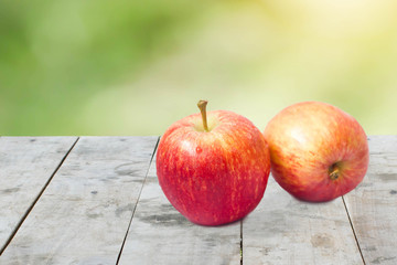 fresh apples on wood panel