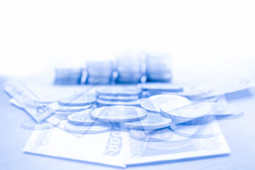 money bills and stack of coin