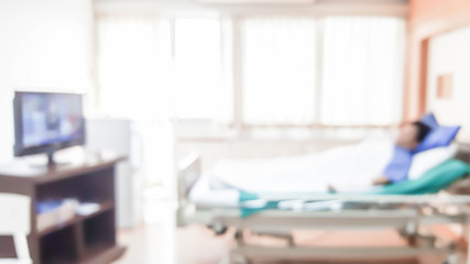 abstract blurred photo of patient alone on hospital bed