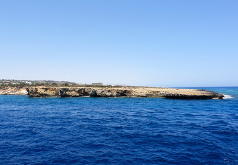 Fototapeta na wymiar Photo of blue sea and rocks in protaras paralimni cyprus island.