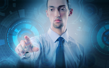Businessman pressing virtual buttons in futuristic concept