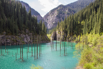 Kaindy Lake in Tien Shan mountain system, Kazakhstan - obrazy, fototapety, plakaty