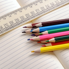 Crayons, a ruler and Notepad closeup