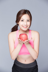 sport woman with an apple