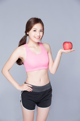 sport woman with an apple