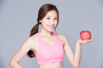 sport woman with an apple