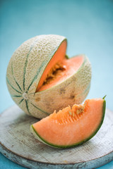 cantaloupe melon on wooden board