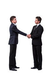 Two twin brothers handshaking isolated on white