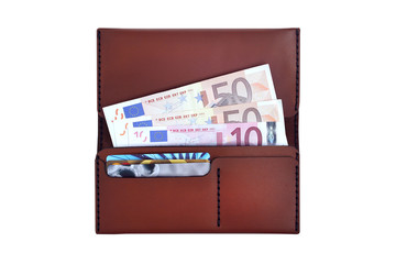 Stylish open brown leather wallet with credit cards and euros isolated on white background. Money