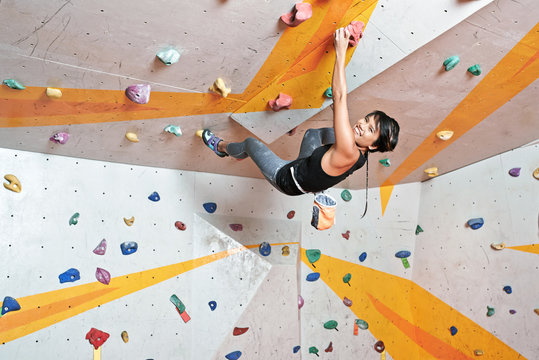 Vietnamese young climber having training in indoor gym