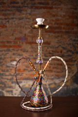 Eastern hookah on wood table