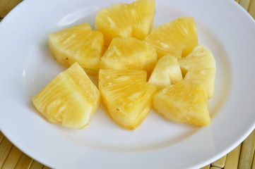 pineapple slice on white plate