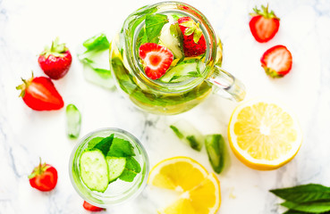 Water with strawberries, lemon, ice, mint. Detox.