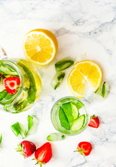 Water with strawberries, lemon, ice, mint. Detox.