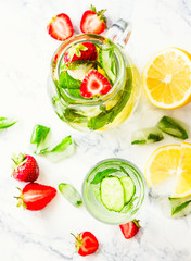 Water with strawberries, lemon, ice, mint. Detox.
