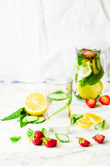 Water with strawberries, lemon, ice, mint. Detox.