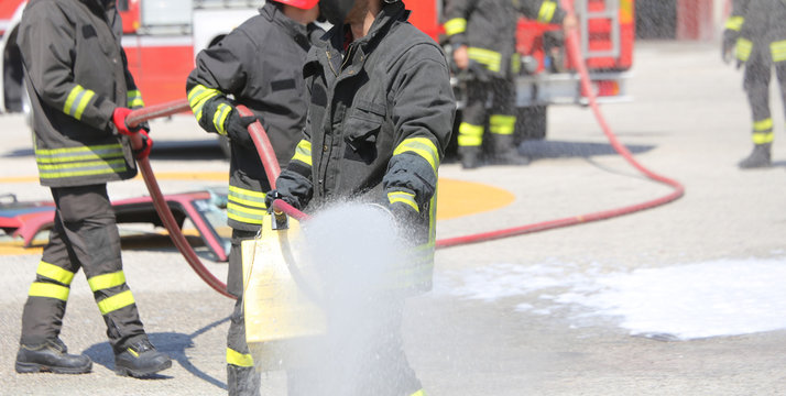 firefighters with the fire extinguisher during a practice sessio