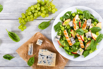 salad with chicken breast, spinach, celery, grapes and cheese