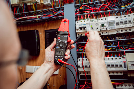 Electrical equipment. Tester in the hands.
