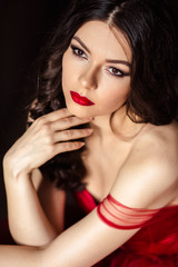 portrait of sensual woman in a long gorgeous red dress