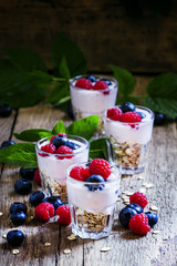 Sweet berry dessert with oatmeal, yogurt, blueberries and raspbe