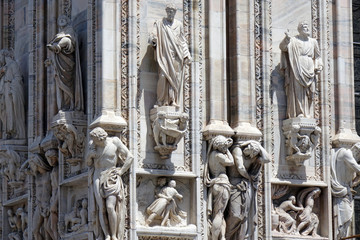 Fototapeta na wymiar Figures decorating walls of Milan's Cathedral