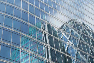 Skyscrapers with glass facade. Modern buildings in Paris business district. Concepts of economics, financial, future.  Copy space for text. Dynamic composition.
