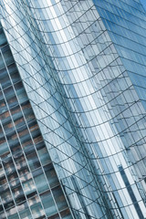 Obraz premium Skyscrapers with glass facade. Modern buildings in Paris business district. Concepts of economics, financial, future. Copy space for text. Dynamic composition. 