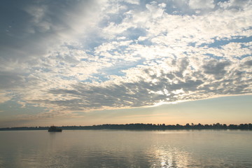 Naklejka premium sunset over the river